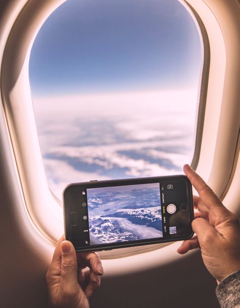 View of an aircraft wing above the clouds